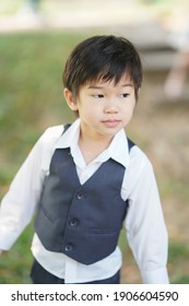 A Boy From Chiang Mai, Thailand In A Polite Suit To Attend A Wedding. With The Light Under The Tree That Looks Too Handsome