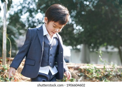 A Boy From Chiang Mai, Thailand In A Polite Suit To Attend A Wedding. With The Light Under The Tree That Looks Too Handsome