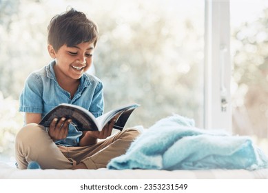 Boy, child and reading book in bedroom for learning, language development or studying literacy. Happy young kid relax with books for storytelling, hobby and knowledge of literature, education and fun - Powered by Shutterstock