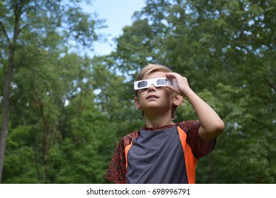 Boy Child Wearing Solar Eclipse Glasses Looking At Sun