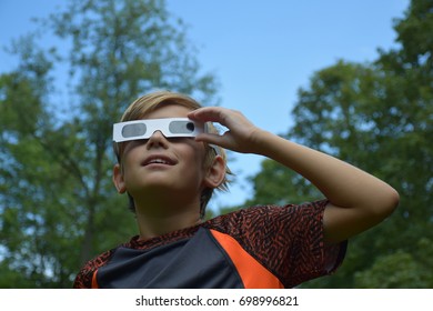 Boy Child Wearing Solar Eclipse Glasses Watching Sun