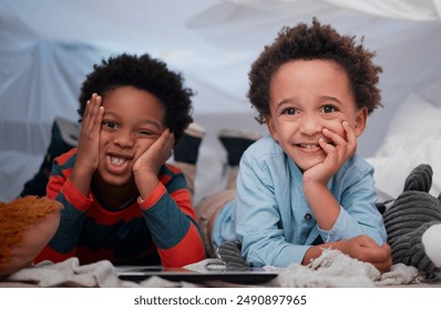 Boy, children and happy with tablet in home for playing educational games and web subscription at sleepover. Blanket fort, friends and digital app for streaming movie, cartoon and video entertainment - Powered by Shutterstock