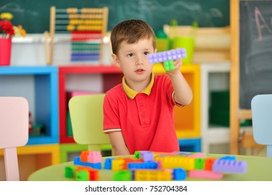 A boy in the children's room playing at the table. - Shutterstock ID 752704384
