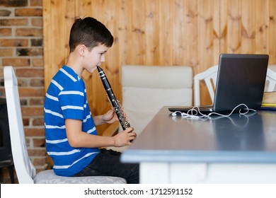 Boy With A Clarinet Plays Music. Online Music Lesson Concept