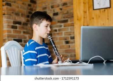 Boy With A Clarinet Plays Music. Online Music Lesson Concept