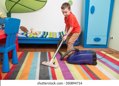boy cleaning  floor with hoover
