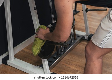 Boy Cleaning Gym Machines After Using It