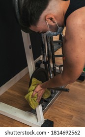 Boy Cleaning Gym Machines After Using It