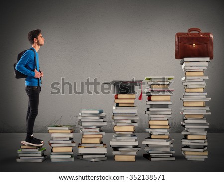 Boy climbing the stairs made of books