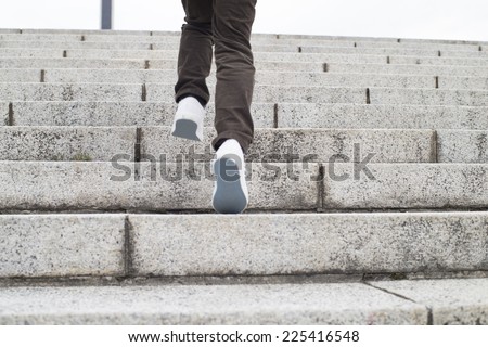 Boy climbing stairs stone