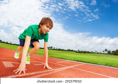 Boy In Colorful Uniform On The Start Ready To Run