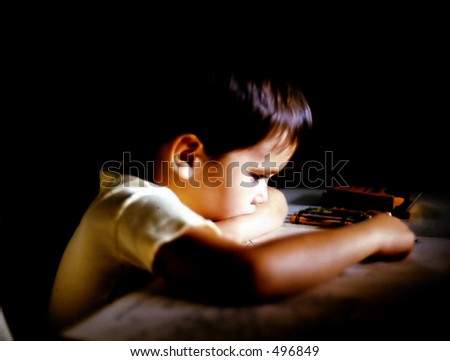 Boy Coloring at Table
