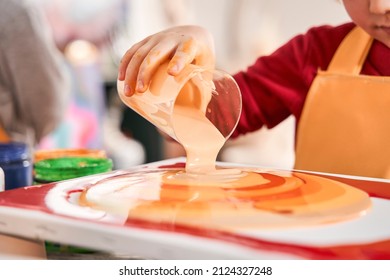 Boy creating a masterpiece at the art school. Kid pouring paints into the canvas - Shutterstock ID 2124327248