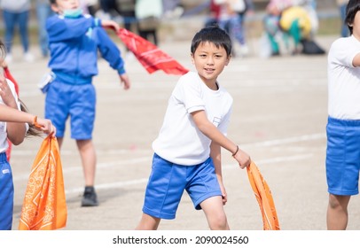 A boy dancing at an elementary school athletic meet