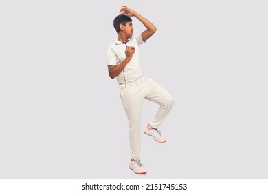 A boy Delivering a spin ball During a Cricket Game - Powered by Shutterstock