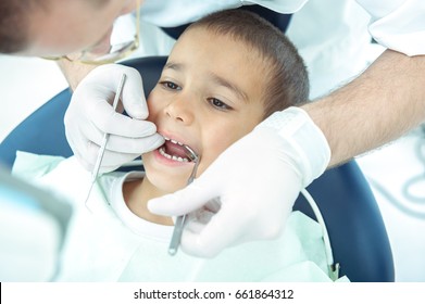 boy at dentist fxing his teeth