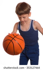 The Boy Dexterously Beat Off A Basketball Ball From A Floor A Hand