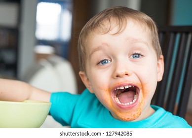 Boy With Dirty Face With Spaghetti Sauce On Face