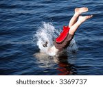Boy diving into the sea