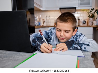 boy does homework online with teacher in coronavirus era - Shutterstock ID 1853050165