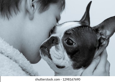 A Boy And A Dog Breed Boston Terrier Sadly Hug And Say Goodbye. Black And White Photography