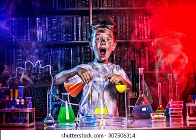 A boy doing experiments in the laboratory. Explosion in the laboratory. Science and education. - Shutterstock ID 307506314