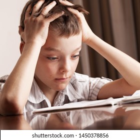 kid doing homework sad