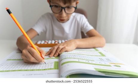 boy doing mental arithmetic on abacus