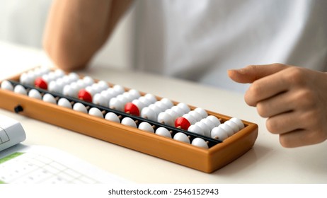 boy doing mental arithmetic on abacus or abacus