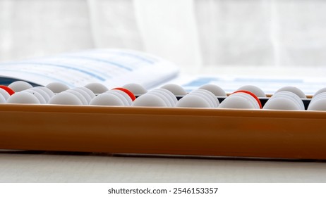 boy doing mental arithmetic on abacus or abacus