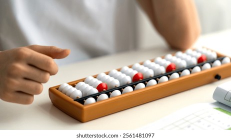 Boy doing mental arithmetic on the abacus