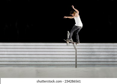 Boy doing skateboard trick on rail - Powered by Shutterstock