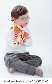 Boy with Down Syndrome playing with puppets