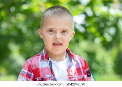 Boy With Down Syndrome, Portrait Of A Disabled Child, Extra Chromossome, Autism, Psychiatric Genetic Disease, Protection Of Children With Down Syndrome.
