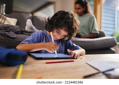 Boy Drawing On Tablet And Smiling