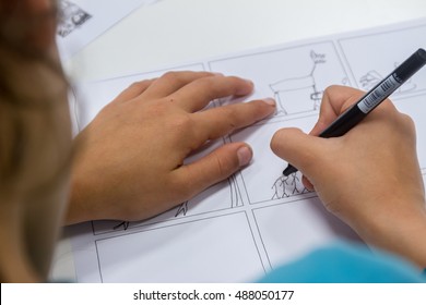 Boy Drawing On White Paper