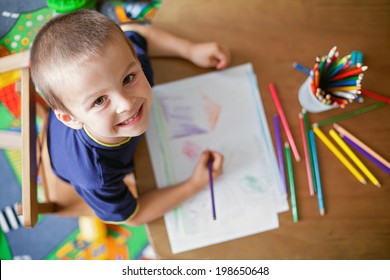 Boy  drawing picture for fathers day