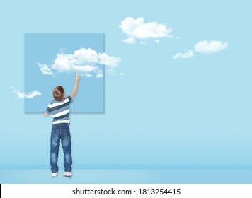 Boy Draws With A Brush White Clouds. Concept Image About Freedom Of Mind And Thinking Outside The Box. Freedom Concept. Free Your Mind.