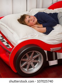 Boy Dreaming In His Car Bed