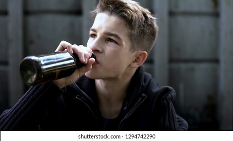 Boy Drinking Beer Sitting In Backstreet, Desire To Be Older, First Experience