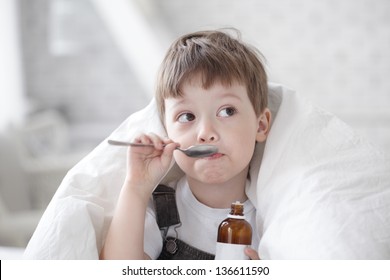 Boy Drinking Cough Syrup