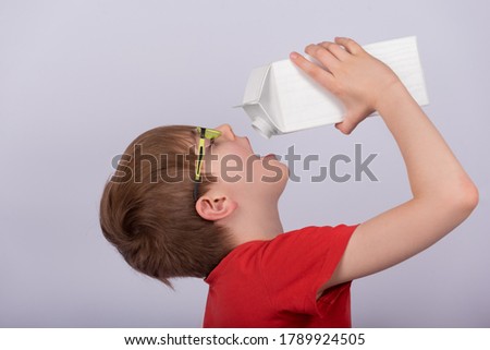 Similar – Image, Stock Photo Baby girl drinking milk from baby bottle