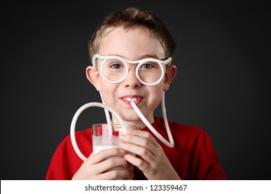 Boy Drinking Milk Through A Silly Straw