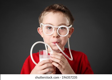 Boy Drinking Milk Through A Silly Straw