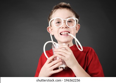 Boy Drinking Milk Through A Silly Straw