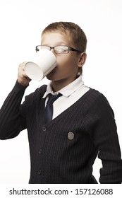 boy drinks from a mug