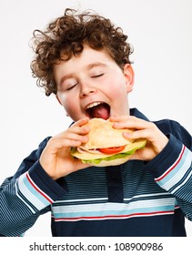 Boy Eating Big Sandwich