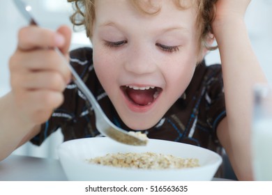 Boy Eating Cereal While Having Breakfast Stock Photo 516563635 ...