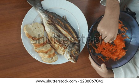 boy eating fish salad