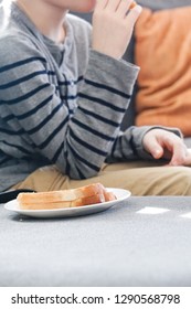 Boy Eating Grilled Cheese Sandwich.